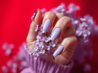 professional nail salon photo of feminine hand with almond gel nails painted in soft lavender pastel polish, glossy gel finish reflecting studio light, delicate hand pose holding small lilac flowers, spring inspired aesthetic, soft natural daylight, dreamy blurred background, shallow depth of field, luxury manicure photography, pinterest beauty inspiration style, ultra realistic macro detail, vertical 2:3
